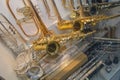 Saxophones and trumpet on the showcase of a music store