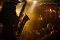 saxophonist playing on a dimly lit stage with audience silhouettes
