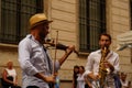 Rome, Italy - July 27, 2020: Italian saxophonist and violinist of a jazz street band