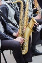 Saxophonists playing in a jazz band, dressed in men& x27;s classic vest and trousers