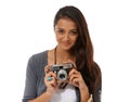 Say cheese. Cropped portrait of a young photographer holding a camera while against a white background.