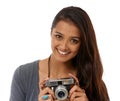 Say cheese. Cropped portrait of a young photographer holding a camera while against a white background.