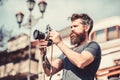 Say cheese. retro photographic equipment. photo of nature. reporter or journalist. Mature hipster with beard. Bearded Royalty Free Stock Photo