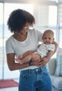 Say hello to my new baby. a young woman carrying her adorable baby girl at home. Royalty Free Stock Photo