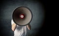 Say it loud, man with a big megaphone and space for your text Royalty Free Stock Photo