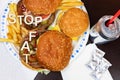 Say No To Junk Food. Juicy burger and fries with anti fast food slogan on it. Anti fast food, time for diet concept Royalty Free Stock Photo