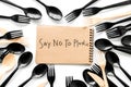 Say no to plastic copy. Eco concept and injunction on the use of plastic flatware on white background top view