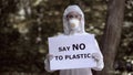 Say no to plastic sign lab worker hands, environmental catastrophe, pollution