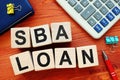 SBA loan concept. Wooden cubes with letters