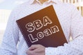 SBA Loan is shown on the conceptual business photo