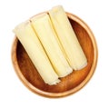 Sbrinz, Swiss hard cheese rolls, rolled thin slices, in a wooden bowl Royalty Free Stock Photo