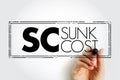 SC Sunk Cost - cost that has already been incurred and that cannot be recovered, acronym text stamp Royalty Free Stock Photo