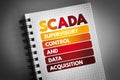 SCADA - Supervisory Control And Data Acquisition acronym on notepad, technology concept background