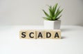 Scada word concept on cubes, network concept. Royalty Free Stock Photo