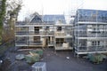 Scaffold at construction of new houses in residential building site UK Royalty Free Stock Photo