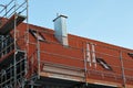 Scaffold and red safety net at a roof