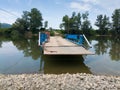 The scaffolder manages a ferry for transporting people and vehicles across the river Bosna in the village of Koprivna,