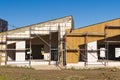 Scaffolding around house for Installing wood siding overhang