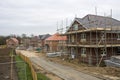 Scaffolding around houses in a new housing development Royalty Free Stock Photo