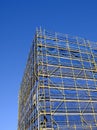 Scaffolding and Blue Safety Cladding on Construction Royalty Free Stock Photo