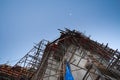 scaffolding for buddhism church construction with moon at evening Royalty Free Stock Photo