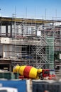 Scaffolding and cement mixer truck Royalty Free Stock Photo