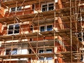 Scaffolding construction at tall brick house