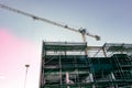 Scaffolding and crane on multistory constructions site Royalty Free Stock Photo