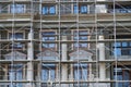 Scaffolding at the facade of a building under construction, multi-storey building, without people Royalty Free Stock Photo