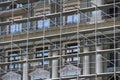 Scaffolding at the facade of a building under construction, multi-storey building, without people Royalty Free Stock Photo