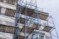 scaffolding on the facade of a house under construction Royalty Free Stock Photo