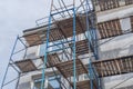 scaffolding on the facade of a house under construction Royalty Free Stock Photo