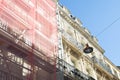 Scaffolding fragment of a scaffolded house wall in street Royalty Free Stock Photo