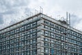 Scaffolding on  house facade, apartment building under construction Royalty Free Stock Photo