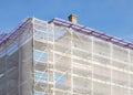 Scaffolding on house facade, apartment builing under construction Royalty Free Stock Photo
