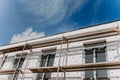 scaffolding on house facade,modern building under construction Royalty Free Stock Photo