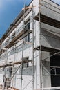 scaffolding on house facade,modern building under construction Royalty Free Stock Photo