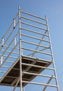 Scaffolding, metal mobile scaffold aginst blue sky background