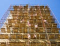 Scaffolding mounted at the end wall of the building for its insulation Royalty Free Stock Photo