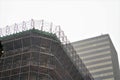 Scaffolding and protective nets on tall city buildings