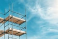 Scaffold structure under blue sky with copy space on right. construction framing and support