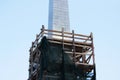 scaffolding at the repaired Obelisk Obelisk in Gatchina, Leningrad Region, Russia. Stage of dismantling of scaffolding. February 1