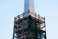 scaffolding at the repaired Obelisk Obelisk in Gatchina, Leningrad Region, Russia. Stage of dismantling of scaffolding. February 1