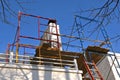 Scaffolding surround a chimney under repair Royalty Free Stock Photo