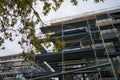 Scaffolding surrounds a residential apartment building under construction. Berlin, Germany