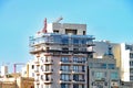 Scaffolding surrounds the top two stories of an apartment block in Sliema in Malta