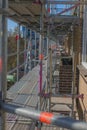 Scaffolding used as a temporary structure to support the building structure and a work platform for employees Royalty Free Stock Photo