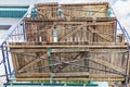 Scaffolding with wooden decks, bottom view. Performing construction work at height. Construction safety Royalty Free Stock Photo