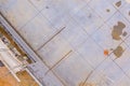 An scaffolding workers on laying cinder concrete blocks on the construction site