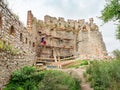 Scaffolding workers rehabilitate the masonry and save the original stonny wall